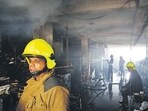 Thane, India - May -21 2026: A massive fire broke out early this morning at the Gavdevi vegetable market located on Gokhale Road in the Naupada area of Thane city. The incident occurred around 3:43 am, resulting in the death of two people. In this tragic fire, Thane Municipal Corporation security guard Kalu Shankar Gadekar (53) and fire brigade station officer Sagar Shinde (43) died due to suffocation caused by heavy smoke. Two other fire personnel were injured while trying to control the blaze and are currently undergoing treatment at Chhatrapati Shivaji Maharaj Hospital in Kalwa. According to preliminary information, the fire spread rapidly due to the presence of a large quantity of clothes, plastic materials, and other inflammable items inside the Gavdevi market. Several shops, stalls, and warehouses were completely gutted, causing huge financial losses to traders. A short circuit is suspected to be the primary cause of the fire ,in Thane ,in Mumbai, India, on, Thursday, May -21, 2026. ( photo by Praful Gangurde / Hindustan Times ) (praful Gangurde)