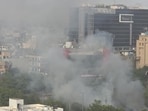 The first incident was reported from Sector 80, Noida in the morning, where open garbage caught fire while the other Another blaze erupted in a garbage lying on a vacant plot in Sector 18. (HT Photo)