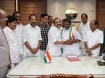 Thiruvanchoor Radhakrishnan (centre) being congratulated by Kerala chief minister VD Satheesan. (HT Photo)