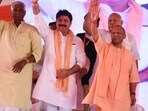 Uttar Pradesh CM Yogi Adityanath and others at an event in Deoria on May 22. (HT photo)