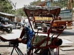 File image: A man sleeps in his rickshaw during a heatwave on a hot summer day in New Delhi