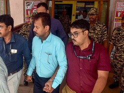 অভিযোগ, সন্দীর ঘোষের বাড়ির ছাদে অনুমতি ছাড়া অতিরিক্ত নির্মাণ করা হয়েছে এবং বাউন্ডারি ওয়াল বাড়িয়ে একটি ম্যানহোল ঢেকে দেওয়া হয়েছে।