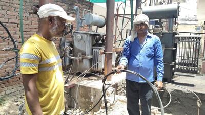 Electricity department staff changing damaged cables in Prayagraj on Friday. (HT) Electricity department staff changing damaged cables in Prayagraj on Friday. (HT)