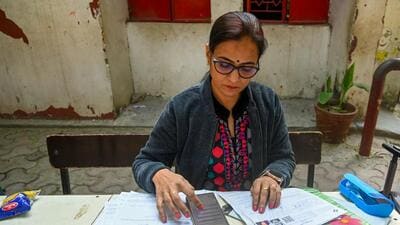 Noida, India - December 01, 2025: Voters fill out their Special Intensive Revision (SIR) forms at a BLO camp set up at Government Adarsh Primary School in Sector 12, in Noida, India, on Monday ,December 01, 2025. (Photo by Sunil Ghosh / Hindustan Times) Noida, India - December 01, 2025: Voters fill out their Special Intensive Revision (SIR) forms at a BLO camp set up at Government Adarsh Primary School in Sector 12, in Noida, India, on Monday ,December 01, 2025. (Photo by Sunil Ghosh / Hindustan Times)
