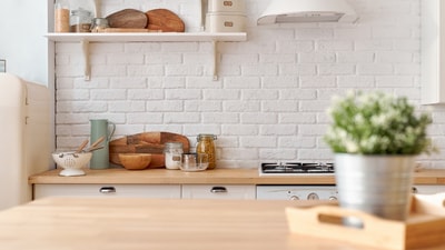 Simple countertop additions and pretty storage pieces can make your kitchen feel cleaner, brighter, organised, and instantly more inviting daily. (Canva.com)