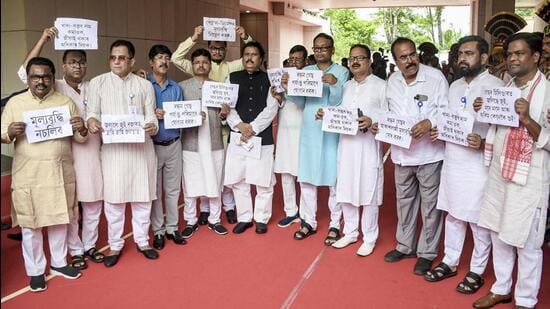 Congress MLas stage a protest during the second day of the Assam assembly session in Guwahati on Friday. (PTI)
