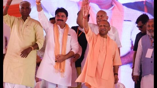 Uttar Pradesh CM Yogi Adityanath and others at an event in Deoria on May 22. (HT photo)