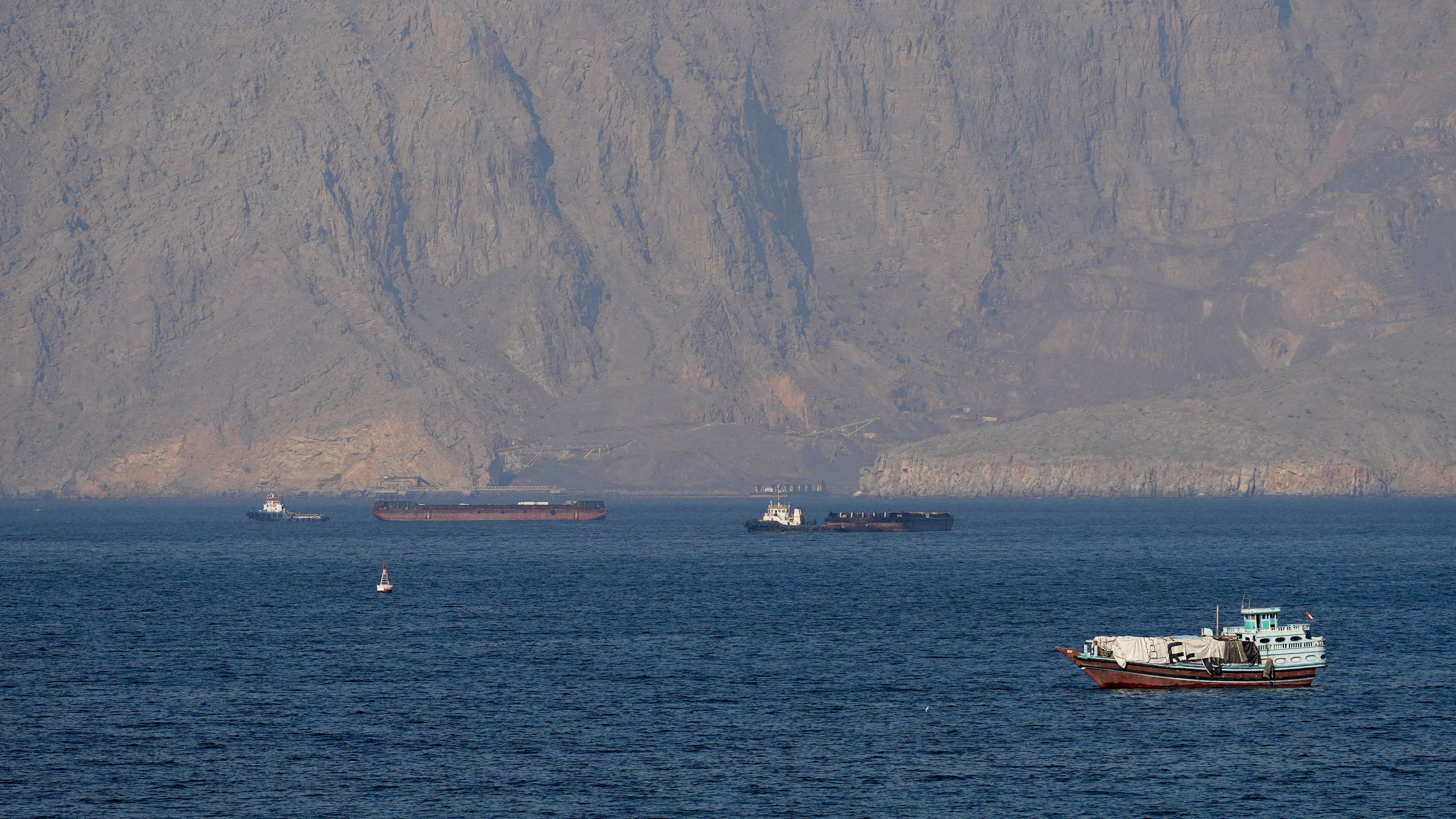 Ships and tankers in the Strait of Hormuz off the coast of Musandam, Oman. (REUTERS)