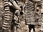 Chinese men carry bricks of tea, of the kind used as currency, to Tibet, as documented by British explorer EH Wilson in 1908. (Wikimedia)