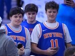 New York Knicks' fans watch warm-ups before Game 3 in a second-round NBA basketball playoff series against the Philadelphia 76ers in Philadelphia.