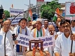 MP Randeep Singh Surjewala, and Haryana Congress chief Rao Narendra Singh, among other Congress workers during a protest in Kaithal on Friday. (HT Photo)