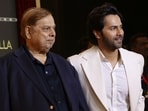 David Dhawan, left, with his son and actor Varun Dhawan, at an event earlier this year. (PTI Photo)(PTI03_26_2026_000026A)