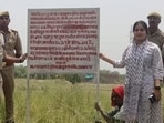 Property attachment under way at Rajapur Malhua in Soraon area of Prayagraj on May 23. (HT photo)