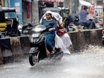 Several low-lying localities witnessed waterlogging, severely impacting vehicular movement and slowing down traffic across major roads. (MAHENDRA KOLHE/HT)