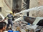 Six fire tenders were deputed to douse the flames. Rescue teams managed to pull out five injured persons from the debris and shifted four of them to the civil hospital. (Manoj Dhaka/HT)