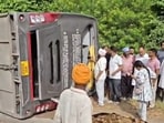 Two students from Jammu were killed after a tourist bus overturned on the Amritsar-Pathankot national highway near Kaler Khurd village in Gurdaspur district on Friday morning. (HT photo)