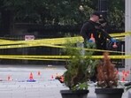 U.S. Secret Service Police place evidence markers on a crime scene after responding to reports of shots fired near the White House.