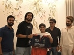 Allu Arjun's son Allu Ayaan receiving the jersey from Venkatesh Iyer.