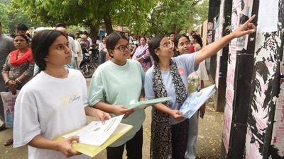 Aspirants looking seat plan before appearing in the National Eligibility cum Entrance Test (NEET) UG 2026 exam conducted by National Testing Agency (NTA) at an examination centre, Magadh Mahila College in Patna, Bihar, India, Sunday,May,03, 2026. (Santosh Kumar/HT photo)