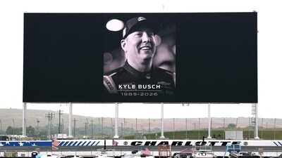 A general view of an LED screen displaying a tribute to Kyle Busch prior to practice for the NASCAR Craftsman Truck Series North Carolina Education Lottery 200 at Charlotte Motor Speedway on May 22, 2026 in Concord, North Carolina. (Getty Images via AFP)