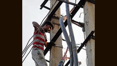 Under the proposed system, consumer complaints would be routed directly to the official mobile phones of linemen and other field staff. (HT File) Under the proposed system, consumer complaints would be routed directly to the official mobile phones of linemen and other field staff. (HT File)
