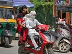 Delhi heatwave: People seen covering their head and face with cloth to protect themselves from heatwave on a hot summer day in Delhi-NCR