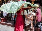 A family shields itself from a scorching sun in Amritsar on Saturday. (ANI) A family shields itself from a scorching sun in Amritsar on Saturday. (ANI)