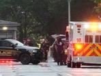 Police and members of the Secret Service stand near an EMS truck after blocking streets around the White House, Saturday, May 23, 2026, in Washington. AP/PTI(AP05_24_2026_000010B)