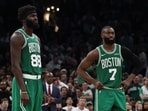 May 2, 2026; Boston, Massachusetts, USA; Boston Celtics guard Jaylen Brown (7) and center Neemias Queta (88) stand on the court late in the second half of their loss to the Philadelphia 76ers in game seven of the first round of the 2026 NBA Playoffs at TD Garden. Mandatory Credit: Winslow Townson-Imagn Images