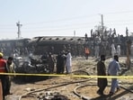 Security personnel inspect damaged derailed carriages after an explosion targeted a train in Quetta on May 24. Security personnel inspect damaged derailed carriages after an explosion targeted a train in Quetta on May 24.