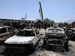 A crane lifts a carriage of a train at the site after an explosion that targeted a train in Quetta on May 24, 2026.