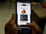 A man browses the Instagram account of the Cockroach Janta Party on social media in Siliguri. The account has surpassed the ruling BJP in Instagram followers. 