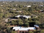 An aerial view shows the home of Nancy Guthrie, the missing mother of "Today" show host Savannah Guthrie, on Friday, March 6, 2026, in Tucson, Ariz. (AP Photo/Rebecca Noble)
