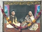 Shri Diwan Swaroop Lal and Shrimati Panno Devi gaze directly toward Ganga ji’s idol on the opposite wall.