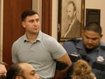 In this image taken from an Associated Press video, conservative activist Jake Lang is led out of Judge H. Reid Poland III's courtroom in handcuffs during livestreamer Dalton Eatherly's hearing, Thursday, May 21, 2026, in Clarksville, Tenn. (AP Photo/Kristin Hall)