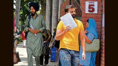 Candidates coming out of the examination centre after giving the UPSC exam in Ludhiana on Sunday. (Manish/HT)
