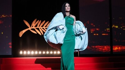 Member of the jury, US actor and producer Demi Moore stole the limelight in Balenciaga pillow sleeves, pairing the teal-coloured accessory with a halter-neck green dress. (AFP)