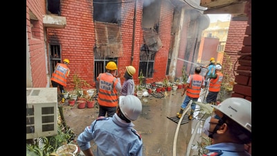 Firefighters faced difficulties controlling the blaze due to heavy storage of documents inside the lower court premises. (Parveen Kumar/HT) Firefighters faced difficulties controlling the blaze due to heavy storage of documents inside the lower court premises. (Parveen Kumar/HT)