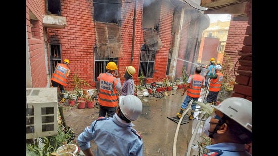 Firefighters faced difficulties controlling the blaze due to heavy storage of documents inside the lower court premises. (Parveen Kumar/HT)