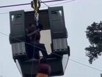 A video grab of a passenger being rescued from the Gulmarg cable car system after it developed a snag on Monday afternoon.