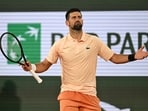 Novak Djokovic of Serbia celebrates after winning the first round men's singles tennis match against against Giovanni Mpetshi Perricard of France at the French Open tennis tournament in Paris, Sunday, May 24, 2026. (AP Photo/Emma Da Silva)