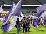Kolkata Knight Riders’ Rinku Singh (C) walks with the team flag. (AFP)