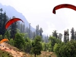 Tourists enjoying paragliding over the Solang valley on Sunday. (Aqil Khan /HT) Tourists enjoying paragliding over the Solang valley on Sunday. (Aqil Khan /HT)