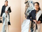 Madhuri Dixit redefines glamour in stunning white saree with chic black jacket. 