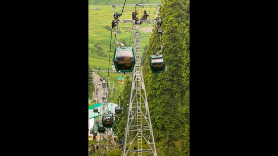 A rescue operation underway at Gulmarg Gondola after the cable car service got halted due to a fault. (PTI)