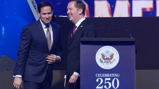 United States Secretary of State Marco Rubio, left, is greeted by US Ambassador to India Sergio Gor, as he arrives on stage to speak at an event celebrating the United States' 250th anniversary, at the Bharat Mandapam convention center, in New Delhi, India, Sunday, May 24, 2026. (AP)