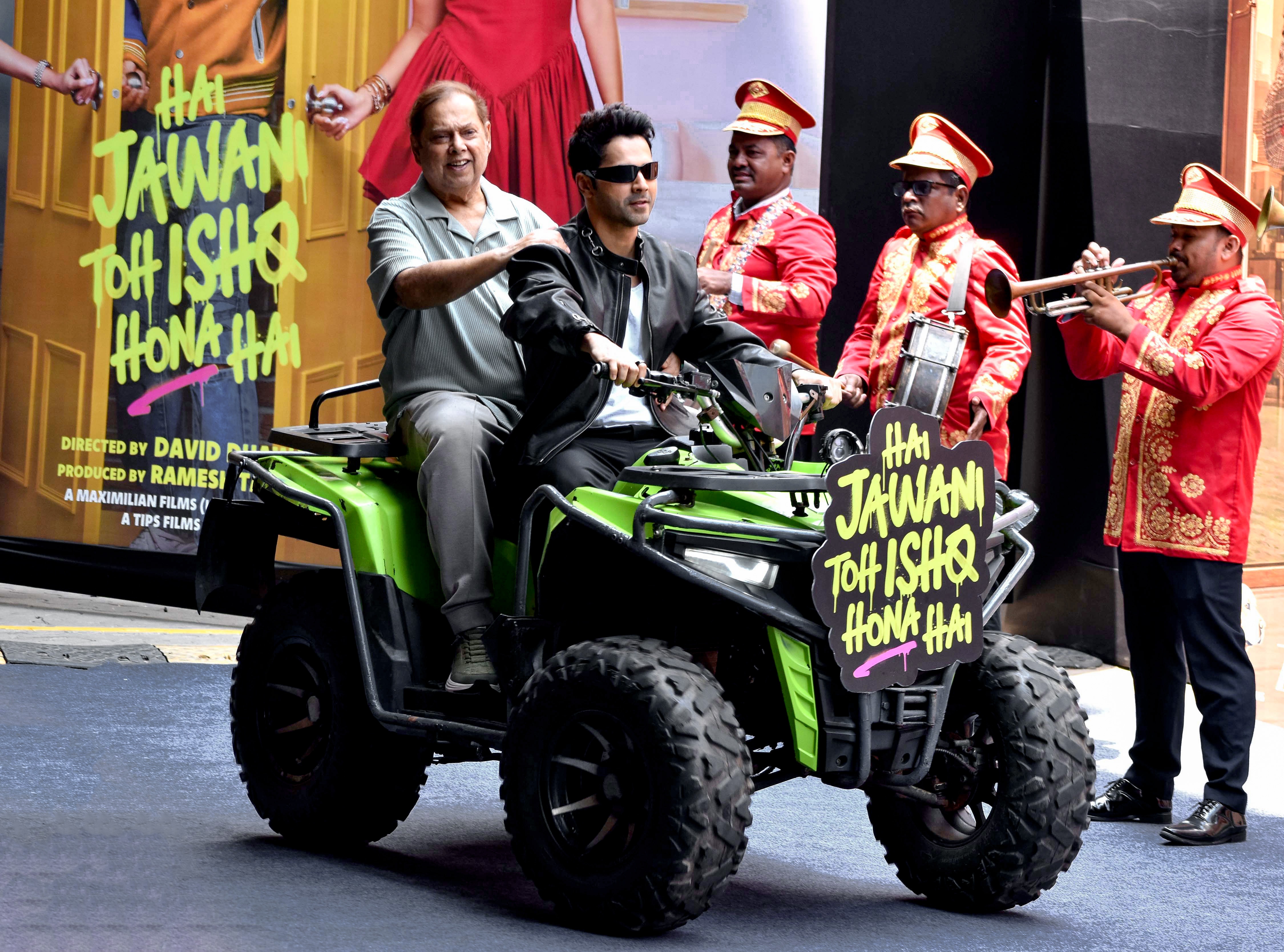 Varun Dhawan rides with filmmaker David Dhawan during the trailer launch of the upcoming film Hai Jawani Toh Ishq Hona Hai, in Mumbai on Saturday. (ANI Photo) (girish srivastav) Varun Dhawan rides with filmmaker David Dhawan during the trailer launch of the upcoming film Hai Jawani Toh Ishq Hona Hai, in Mumbai on Saturday. (ANI Photo) (girish srivastav)