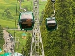 A rescue operation underway at Gulmarg Gondola after the cable car service got halted due to a fault. (PTI)