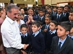 Chief minister meeting students at a government school in Chhota Shimla on Monday. (HT Photo)