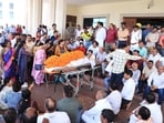 Jharkhand Assembly staff and officers gather at the Assembly portico to pay tribute to a woman staff member who died on Tuesday in Ranchi, allegedly due to medical negligence at a city hospital. (HT Photo)